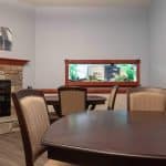 Retreat of Atlana Dining Room with a view of the Aquarium in the wall