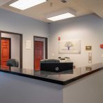 Retreat of Atlanta Reception Desk with a computer