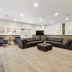 Upstairs common area with sofas and chairs and ottoman