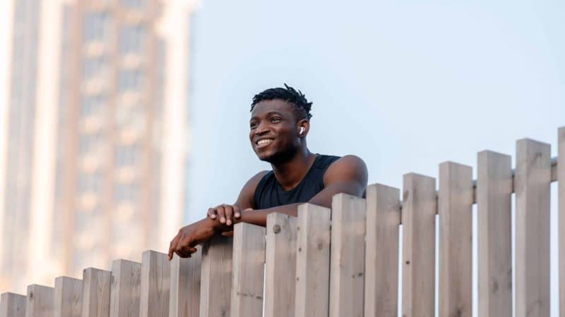 Happy man in sportswear after exercising smiling through his recovery journey
