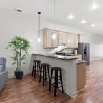 NORA House sober living facility view of counter with stools in the Kitchen area