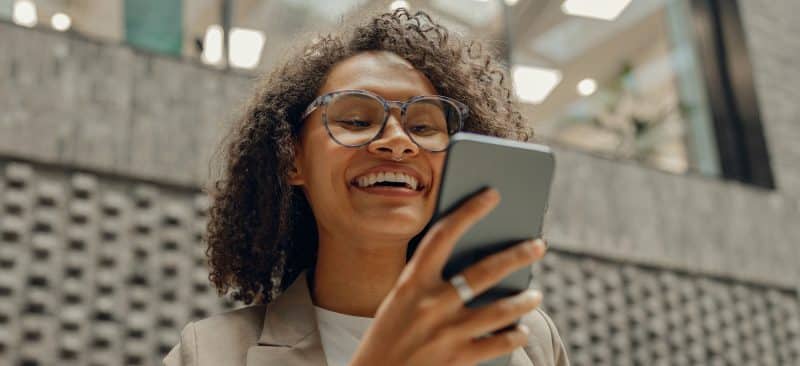 Woman looking at RecoverNow.com on her phone.