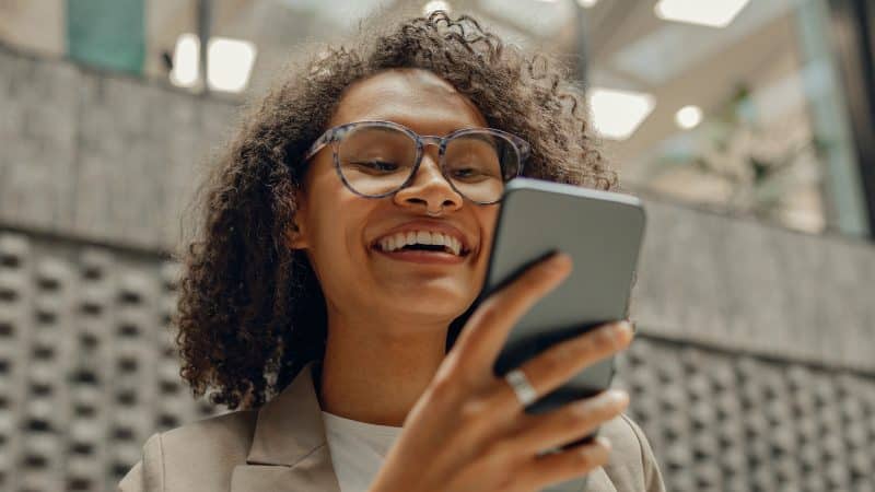 Woman looking at RecoverNow.com on her phone.