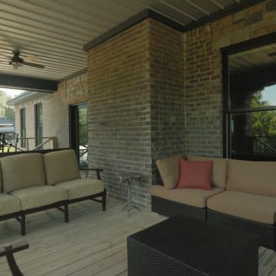 Seating on the porch of Recover Nows Central Alabama sober living and outpatient rehab campus.