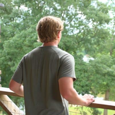 Man looking at greenery at Sober Living House Alabama.