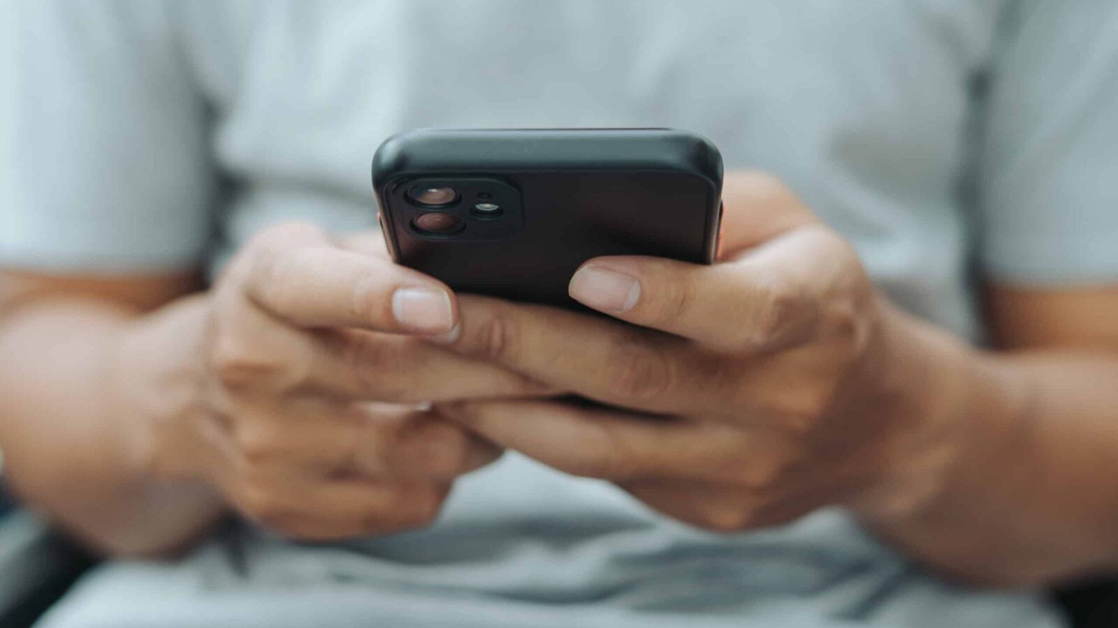 Close-up of a person's hands holding a smartphone
