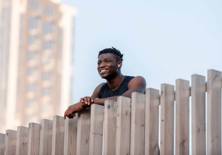 Happy man in sportswear after exercising smiling through his recovery journey