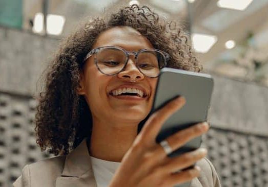 Woman looking at RecoverNow.com on her phone.